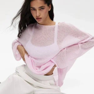 A soft and loose knitted long-sleeved blouse with a European and American ins style, featuring a hollowed-out sweater