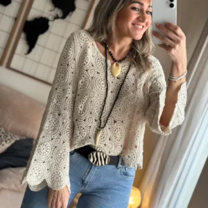 The pullover with hollowed-out knitting is elegant for beach vacation and travel